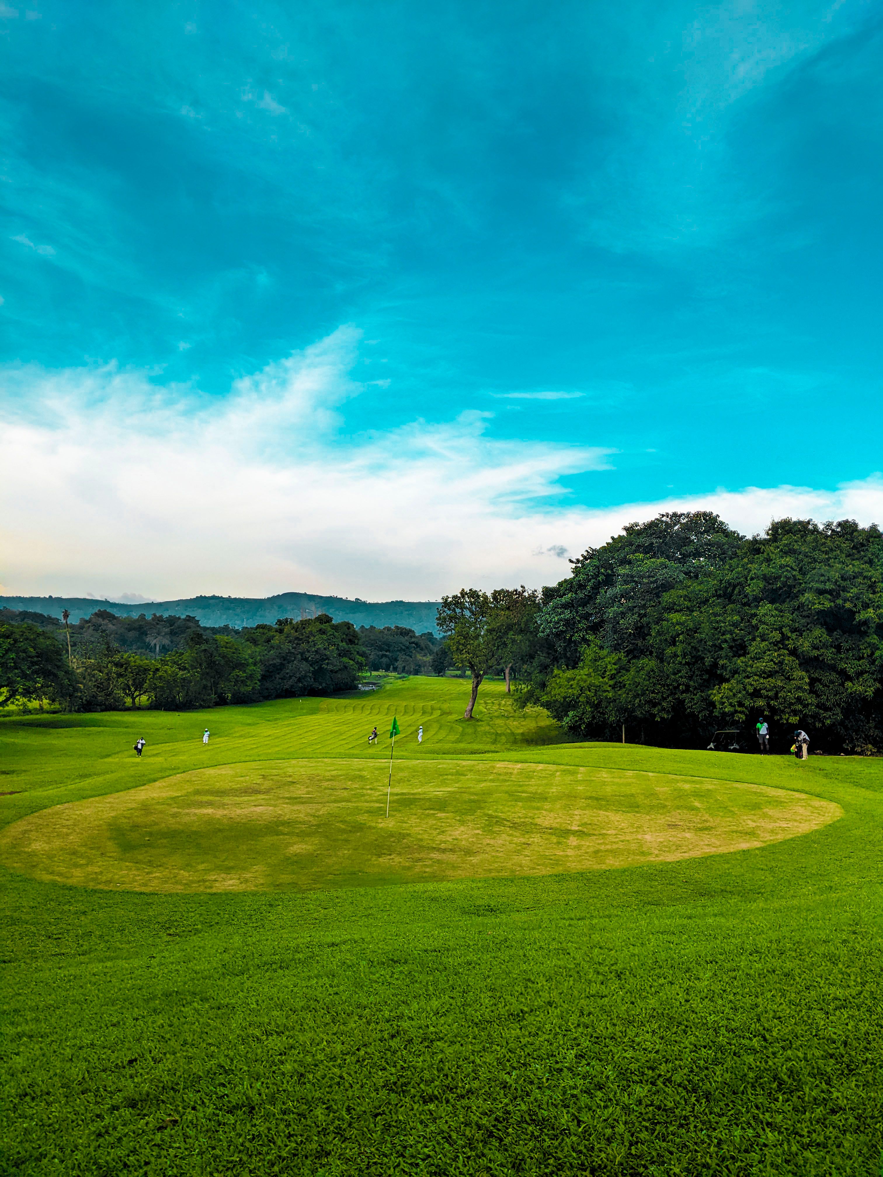 Aerial view of a manicured green and bunkers